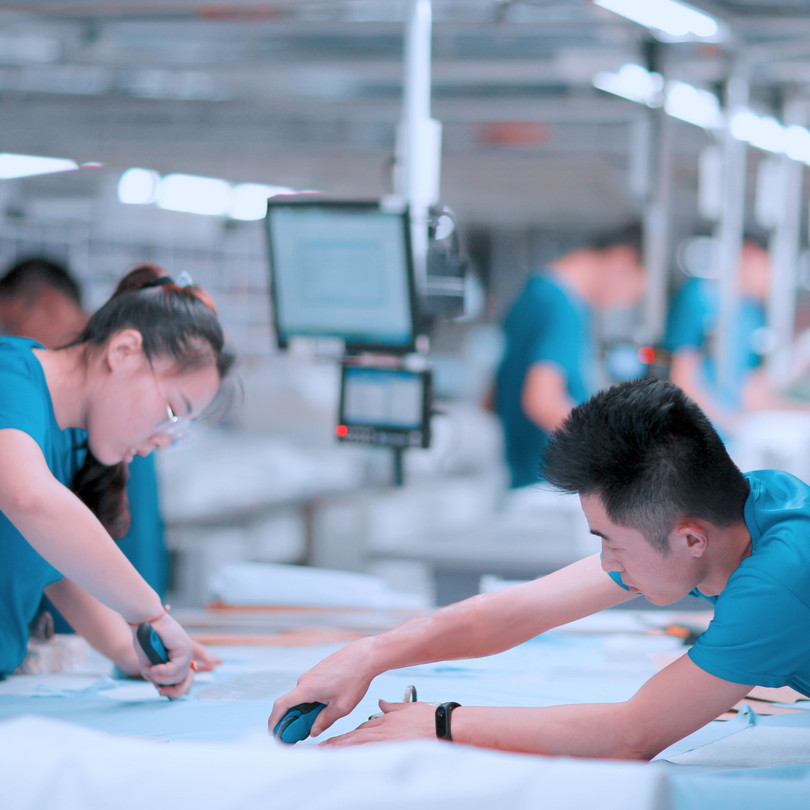 Production of made-to-measure suits, at the KuteSmart firm in Shandong, China.